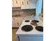 White appliances and granite countertops in this kitchen at 20 Annapolis Ln, Rotonda West, FL 33947