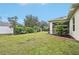 Landscaped backyard with a screened patio and privacy fence at 2236 Gascom St, North Port, FL 34288