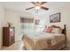 Guest bedroom with queen bed and wood dresser at 2236 Gascom St, North Port, FL 34288