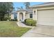 House exterior showcasing a walkway and landscaping at 2236 Gascom St, North Port, FL 34288