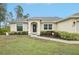 House exterior showcasing a walkway and landscaping at 2236 Gascom St, North Port, FL 34288