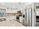 Modern kitchen with stainless steel appliances and granite countertops at 2236 Gascom St, North Port, FL 34288