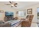 Living room with recliner chairs and a large TV at 2236 Gascom St, North Port, FL 34288