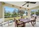 Relaxing screened porch with table and chairs at 2236 Gascom St, North Port, FL 34288