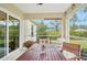 Spacious screened porch overlooking backyard at 2236 Gascom St, North Port, FL 34288