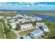 Scenic aerial shot of waterfront condos with beautiful river views and lush green surroundings at 10300 Coral Landings Ct # 93, Placida, FL 33946