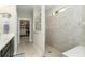 Spa-like bathroom with walk-in shower and adjacent large closet at 13092 Rinella St, Venice, FL 34293