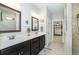 Elegant bathroom with double vanity, walk-in shower, and large closet at 13092 Rinella St, Venice, FL 34293