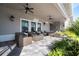 Relaxing community patio with wicker furniture, ceiling fans, and tile flooring at 13092 Rinella St, Venice, FL 34293