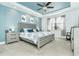 Main bedroom with light blue walls and a large window at 13092 Rinella St, Venice, FL 34293