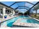 Resort-style pool and spa with covered patio and seating at 13092 Rinella St, Venice, FL 34293