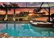 Stunning sunset view over the pool and spa at 13092 Rinella St, Venice, FL 34293