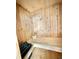 Clean and spacious sauna with wooden walls and bucket at 13092 Rinella St, Venice, FL 34293