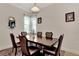 Formal dining room with dark wood table and six chairs at 13104 Creekside Ln, Port Charlotte, FL 33953