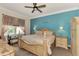 Main bedroom with king-size bed and light blue accent wall at 13104 Creekside Ln, Port Charlotte, FL 33953