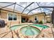 Relaxing pool and spa area with patio furniture at 13104 Creekside Ln, Port Charlotte, FL 33953