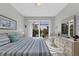 Main bedroom with sliding glass doors leading to a patio at 15764 Autry Cir, Port Charlotte, FL 33981