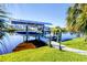 Private boat dock with covered lift and solar panels at 15764 Autry Cir, Port Charlotte, FL 33981