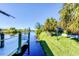 Wooden walkway leads to a dock on a calm waterway at 15764 Autry Cir, Port Charlotte, FL 33981