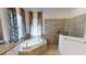 Elegant bathroom with soaking tub and walk-in shower at 15048 Spanish Point Dr, Port Charlotte, FL 33981