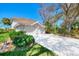 Two-story condo, two-car garage, and lush landscaping at 3113 Club Dr # 118, Port Charlotte, FL 33953