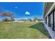 Spacious backyard with grassy area and fire pit at 7381 Thomas St, Englewood, FL 34224