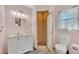 Bathroom with white vanity, shower, and toilet at 7381 Thomas St, Englewood, FL 34224
