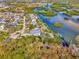 Aerial view of waterfront property with private dock and lush landscaping at 105 Crestview Dr, Englewood, FL 34223