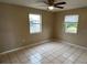 Bedroom with tile floors and two windows at 21242 Glendale Ave, Port Charlotte, FL 33952