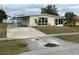 Ranch-style home with a carport and yard at 21242 Glendale Ave, Port Charlotte, FL 33952