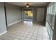 Bright living room featuring tile floors and sliding doors at 21242 Glendale Ave, Port Charlotte, FL 33952