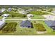 Aerial view of house and surrounding neighborhood at 384 Baytree Dr, Rotonda West, FL 33947