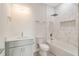 Bathroom with gray vanity, marble shower, and bathtub at 384 Baytree Dr, Rotonda West, FL 33947