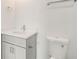 Modern bathroom with gray vanity, white countertop, and toilet at 384 Baytree Dr, Rotonda West, FL 33947