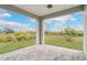 Covered patio with paver floor and view of backyard at 384 Baytree Dr, Rotonda West, FL 33947