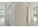 Bright hallway with white doors and tile floors at 384 Baytree Dr, Rotonda West, FL 33947