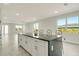 Kitchen island with dark countertop and seating for three at 384 Baytree Dr, Rotonda West, FL 33947