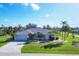 Single-story home with a spacious yard and palm trees at 78 Lima St, Punta Gorda, FL 33983