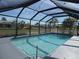 Sparkling screened pool with a spacious deck and string lights at 78 Lima St, Punta Gorda, FL 33983