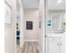 Clean bathroom with a hallway view and a sink at 15576 Aldama Cir, Port Charlotte, FL 33981