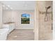 Bathroom with soaking tub, walk-in shower, and granite vanity at 15576 Aldama Cir, Port Charlotte, FL 33981