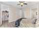 Bedroom with queen bed, walk-in closet, and ceiling fan at 15576 Aldama Cir, Port Charlotte, FL 33981