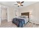 Bedroom with queen bed, ceiling fan and en-suite bathroom at 15576 Aldama Cir, Port Charlotte, FL 33981