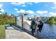 Boat on lift at waterfront property at 15576 Aldama Cir, Port Charlotte, FL 33981