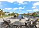 Relaxing canal-front patio with seating and fire pit at 15576 Aldama Cir, Port Charlotte, FL 33981
