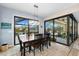 Bright dining room with sliding glass doors leading to a pool and patio at 15576 Aldama Cir, Port Charlotte, FL 33981