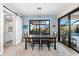Bright dining room with sliding glass doors, a pool view, and barn door at 15576 Aldama Cir, Port Charlotte, FL 33981