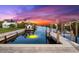Private dock with boat lift on peaceful canal, offering serene waterfront views at 15576 Aldama Cir, Port Charlotte, FL 33981
