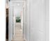 Hallway with doors to bedrooms and closets at 15576 Aldama Cir, Port Charlotte, FL 33981