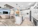 Open concept kitchen with large island and stainless steel appliances at 15576 Aldama Cir, Port Charlotte, FL 33981